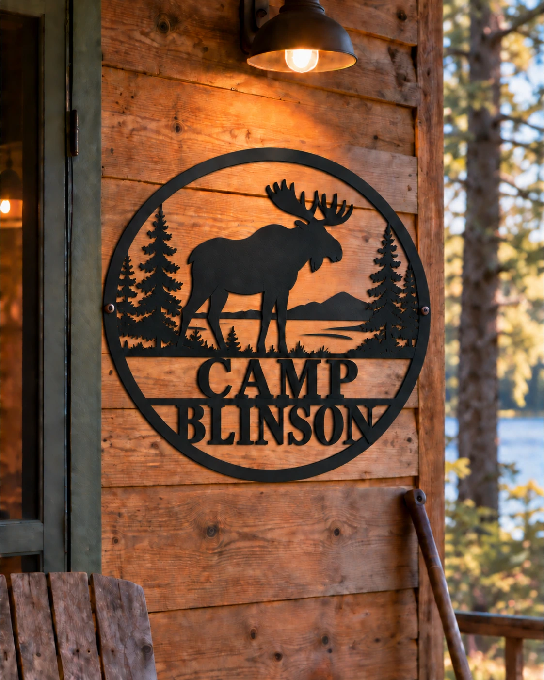 Camp Blinson moose metal sign on a warm pine porch